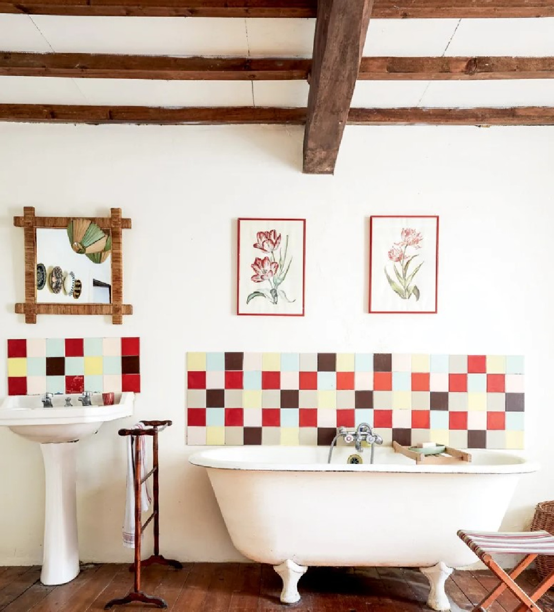 Handmade multicolored tile in an eclectic bath with clawfoot tub in a 19th century French cottage in Toulouse by Lucinda Chambers - photo by Paul Massey. #frenchcottage #frenchfarmhouse #interiordesignl