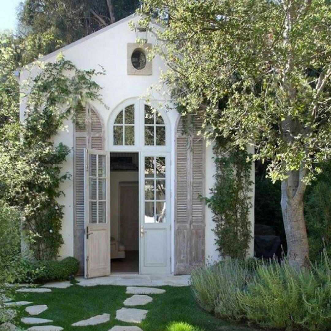 Kelly Harmon Design - storybook style white exterior with rustic wood shutters. #oldworldstyle #whitehouses