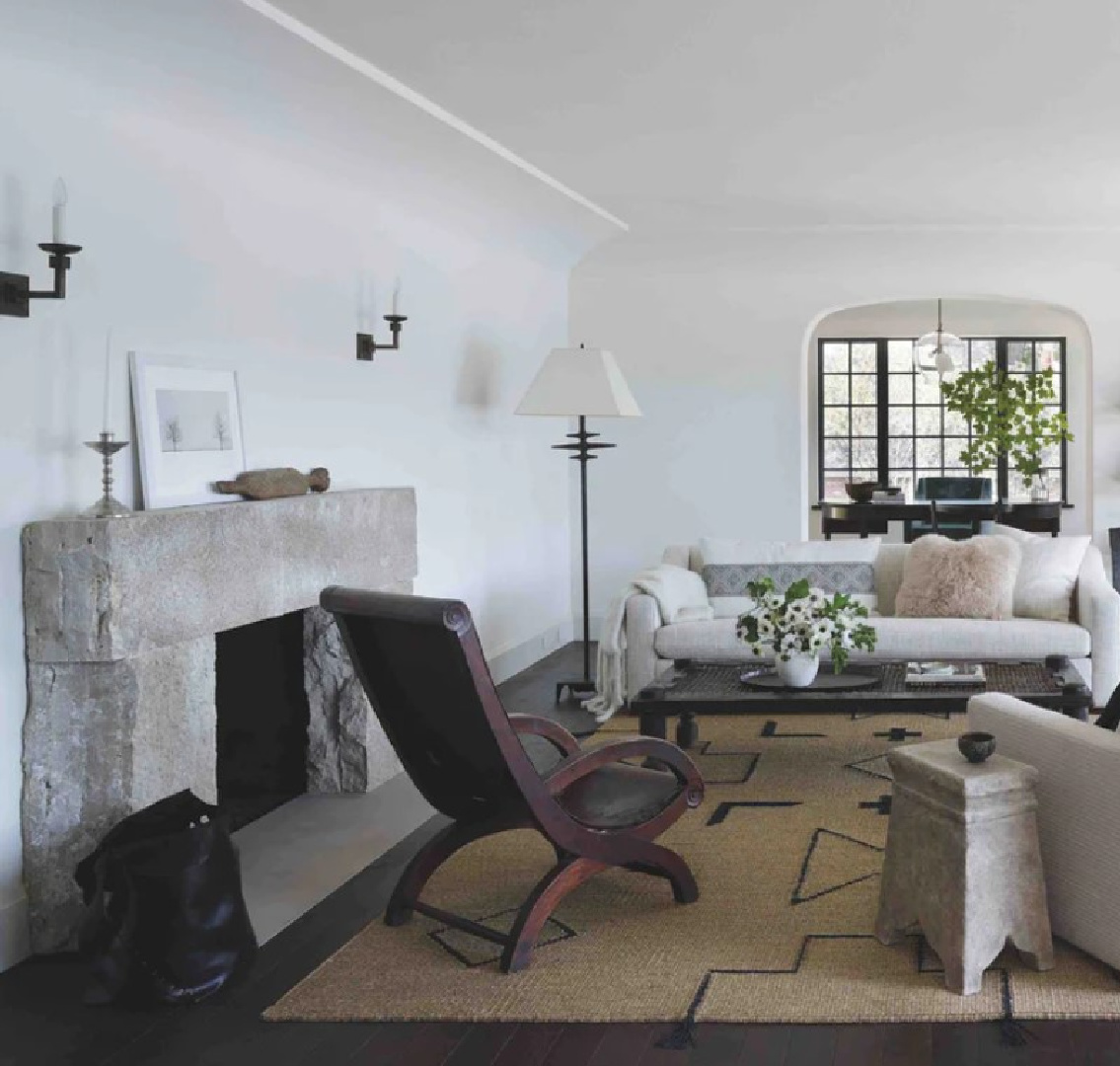 Michael Del Piero space with rustic fireplace and natural materials in TRAVELED AND TEXTURAL (Beta-Plus, 2023).