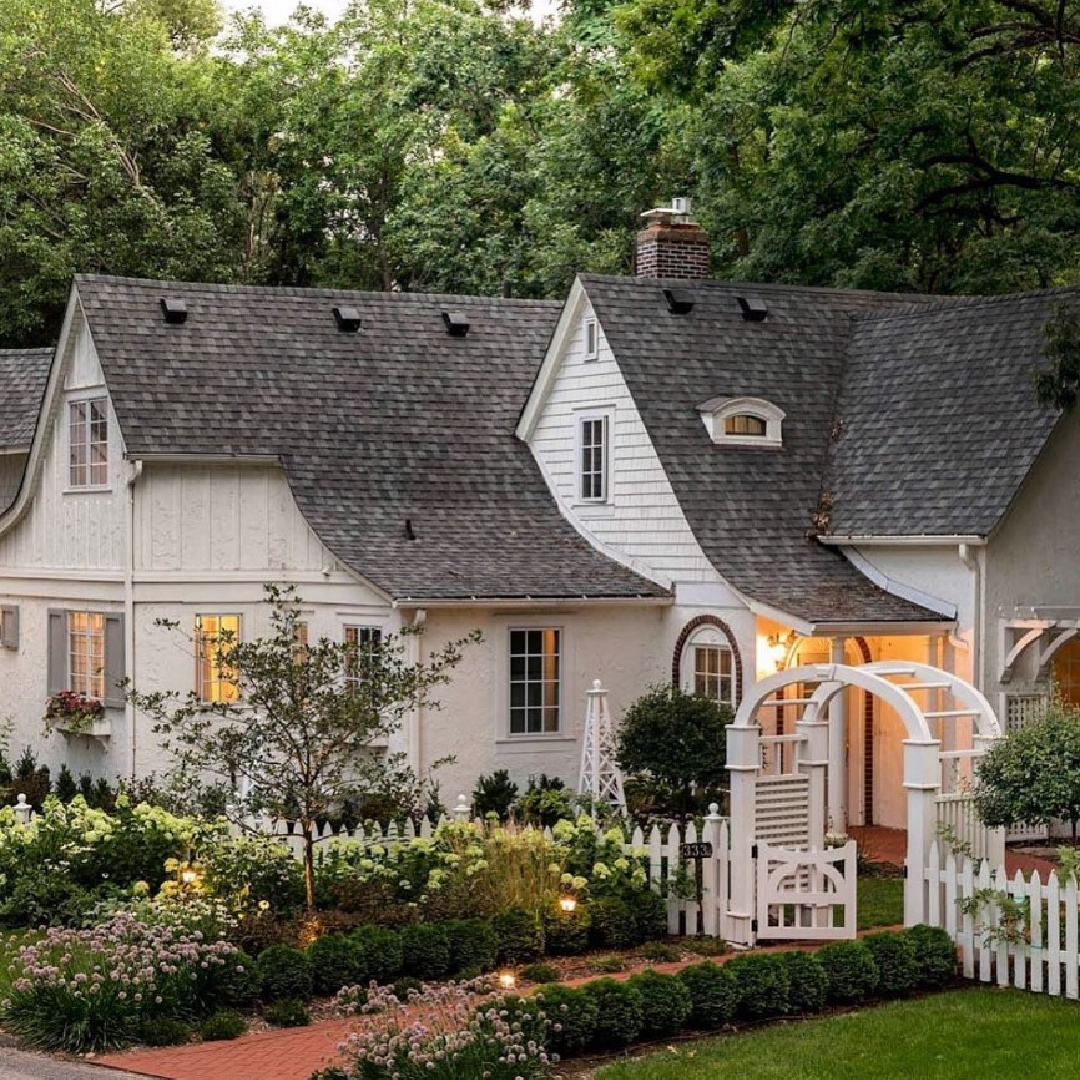 @momsdesignbuild - Stunning white cottage and garden with white picket fence. #whitecottages #storybookhomes #whitehouseexteriors