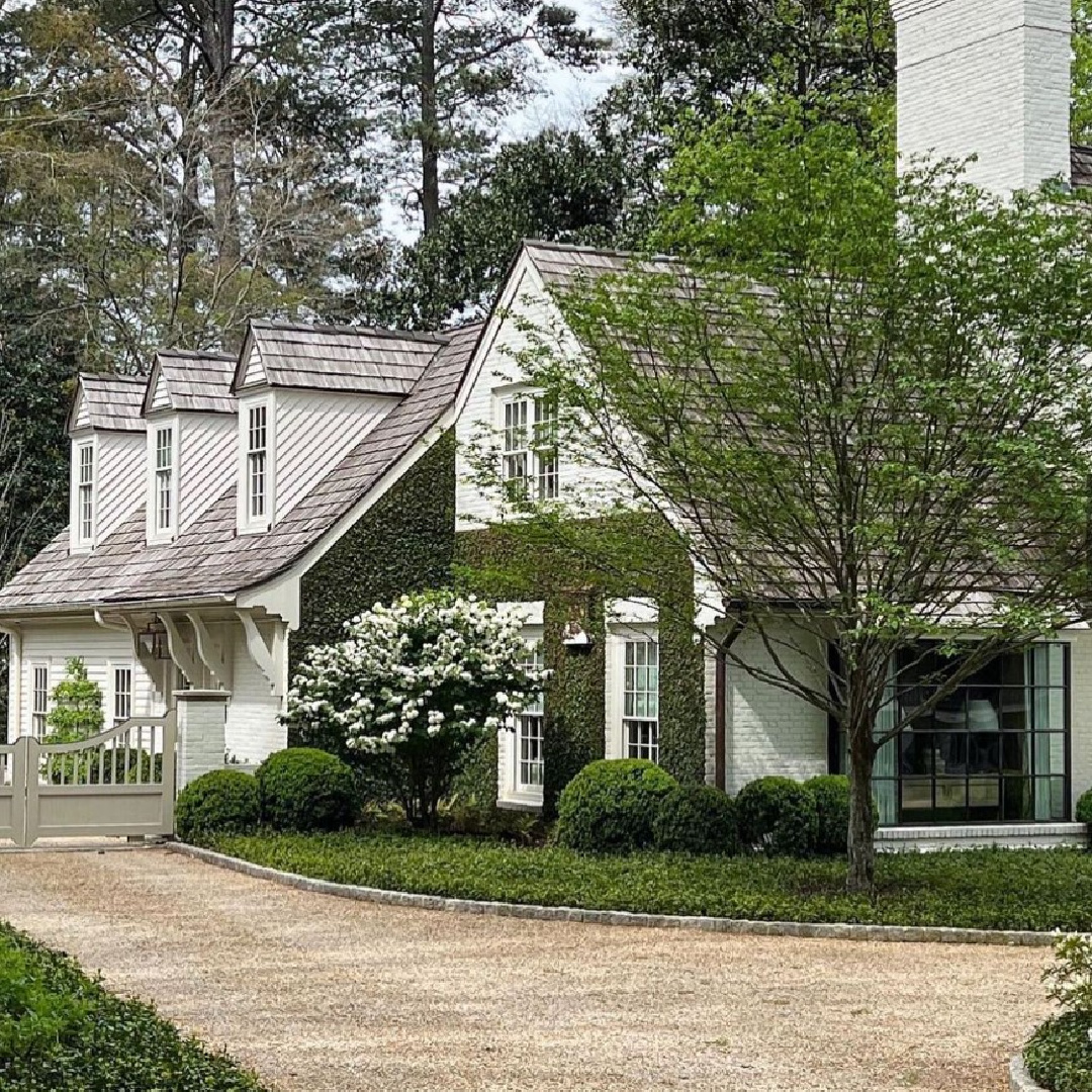 @privatenewport - Lovely white house exterior with stunning gardens, gravel driveway and dormers. #whitecottages #whitehouseexteriors