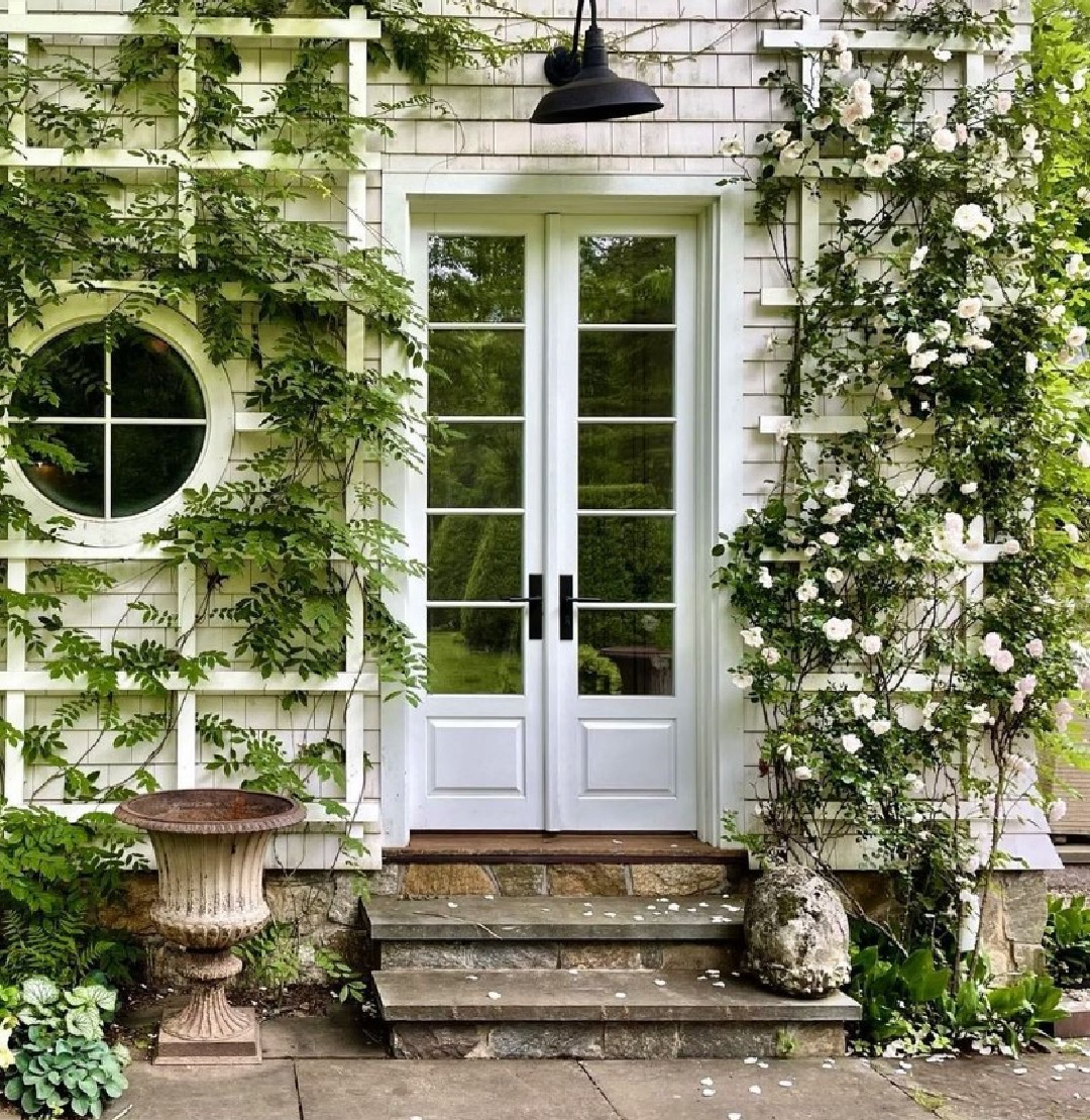 @stephensillsassociates - Beautiful white shingle style house with climbing roses and French doors. #frenchfarmhouse #frenchcountry #climbingroses