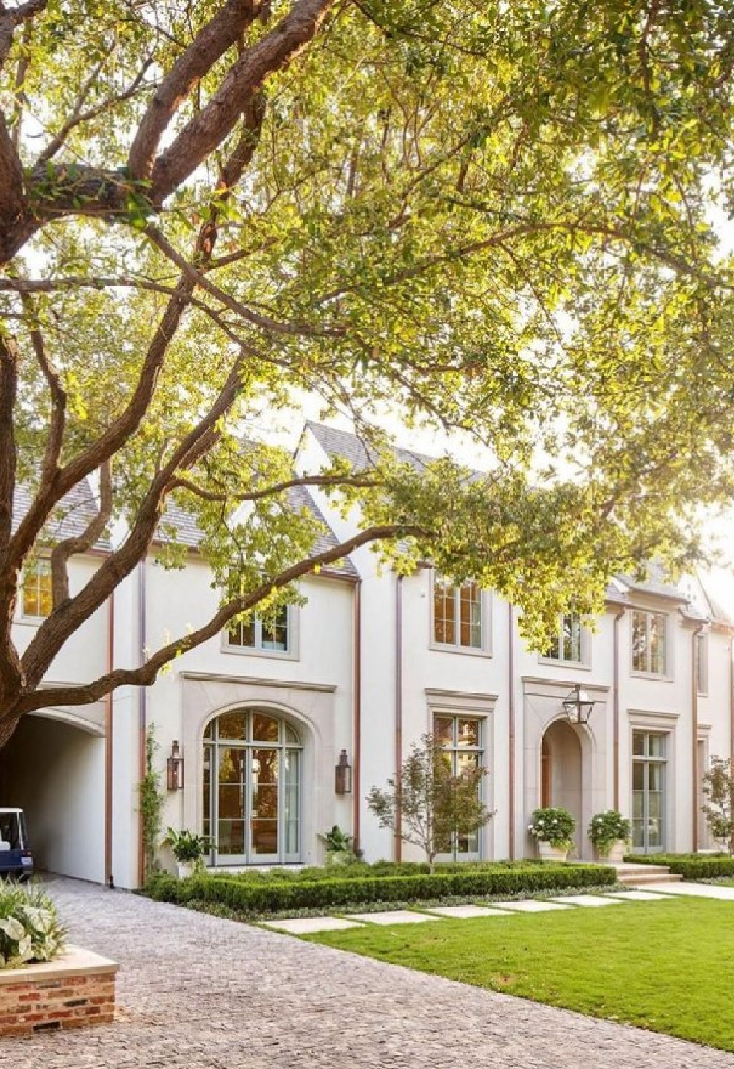 @tatumbrowncustomhomes - Stunning white house exterior with arched details. #classicarchitecture #traditionalhouses #whitehouseexteriors