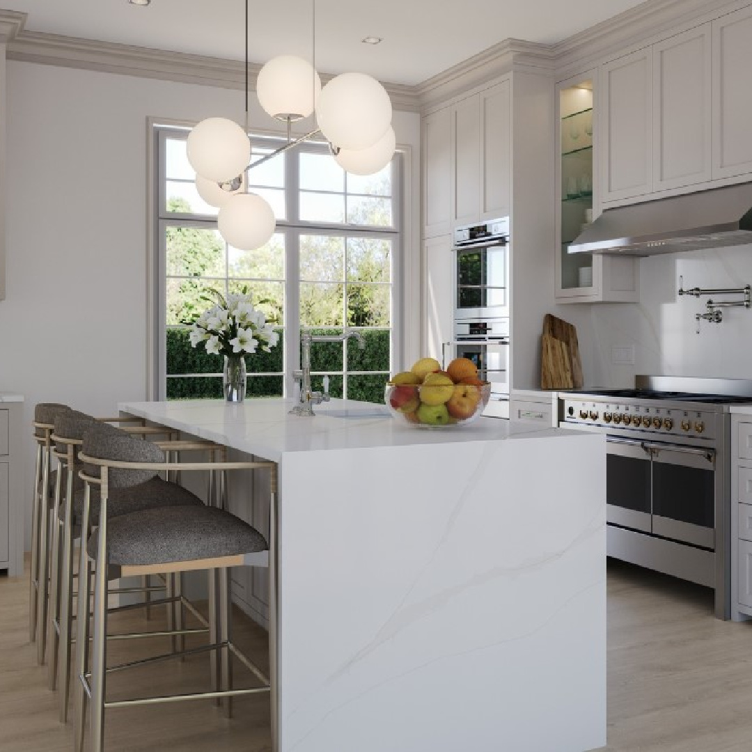 Calacatta Oro quartz (Viatera) in a beautiful white kitchen. #calacattaoro #viateraquartz