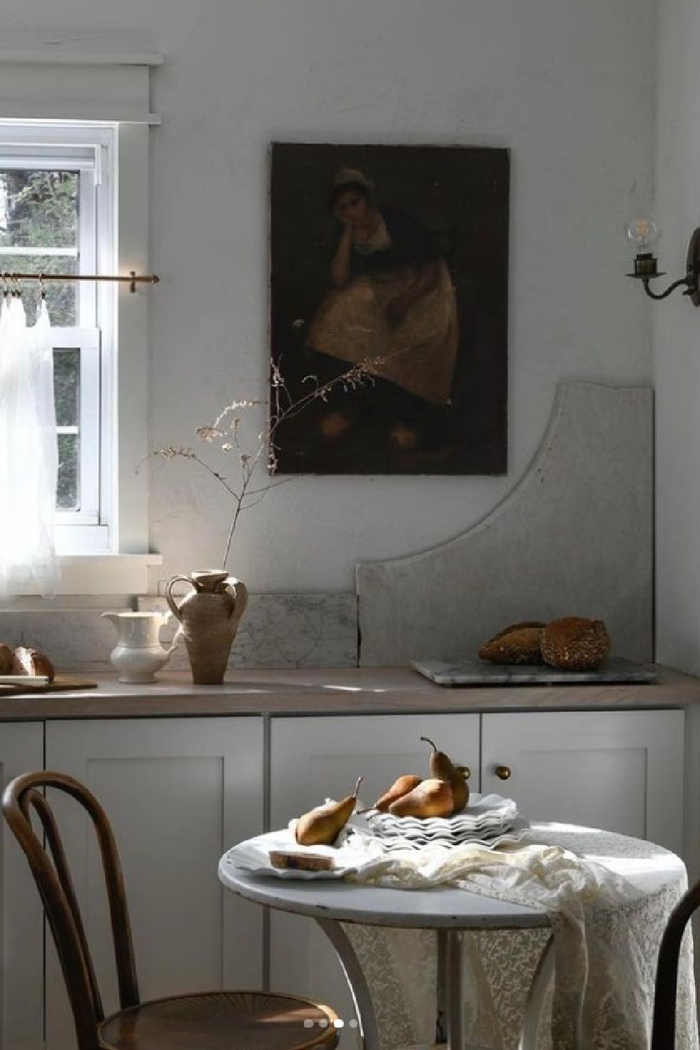 Lovely, artful, and soul-filled white kitchen with European country inspired design elements - @erinashkelly. #europeancountrykitchen #wabisabikitchen #whitekitchens