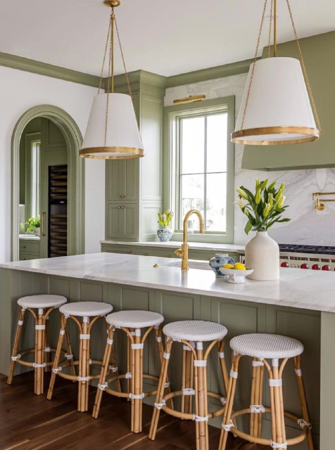 Elegant Lichen green kitchen with unlacquered brass in @chdmag by @ag.interiors (photo: @calliecocreative). #FarrowandBallLichen. #greenkitchens