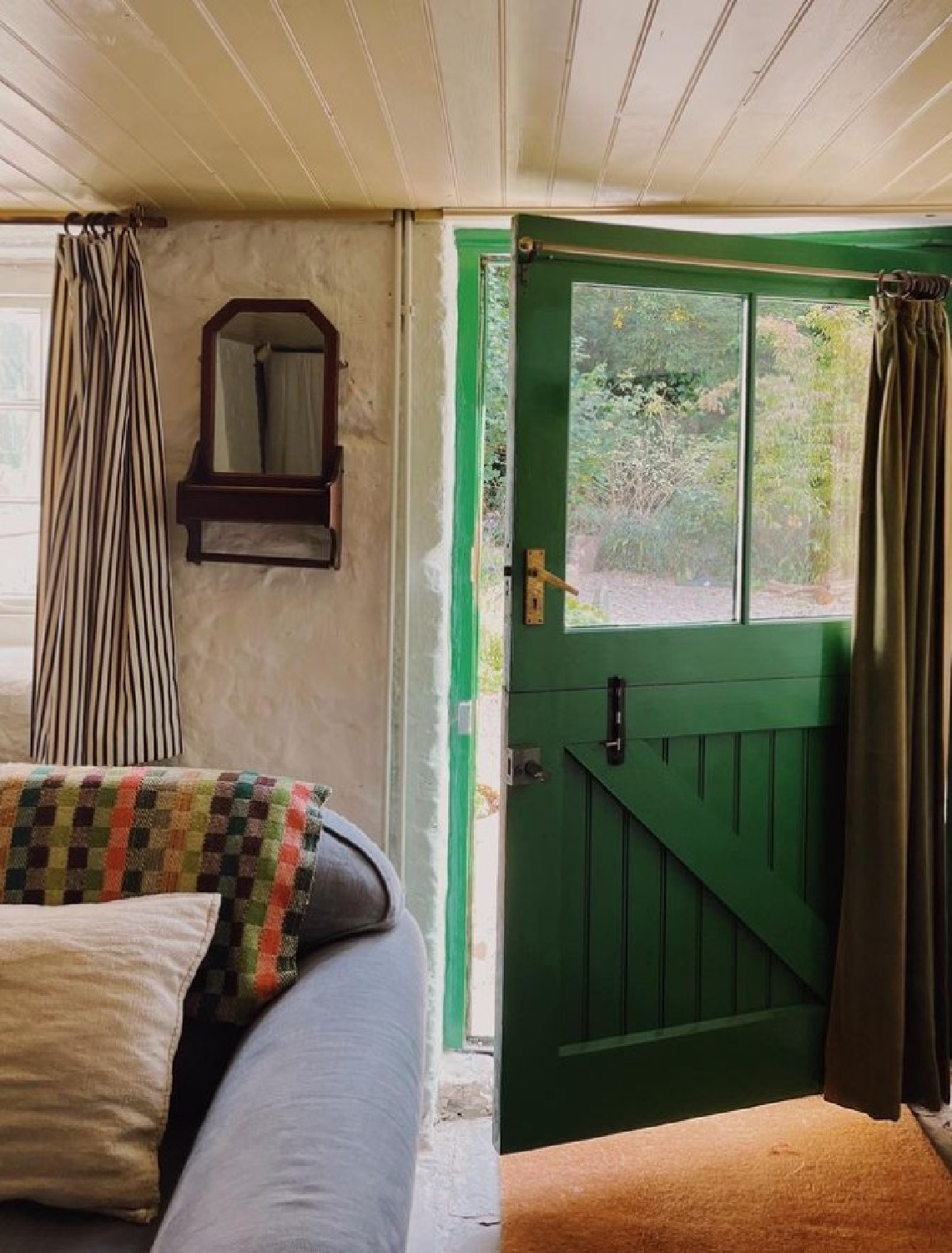 Gorgeous warm beigey blush walls and green door in a charming Welsh cottage - @little_mill_abergavenny. #cottagecozy #littlemillabergavenny