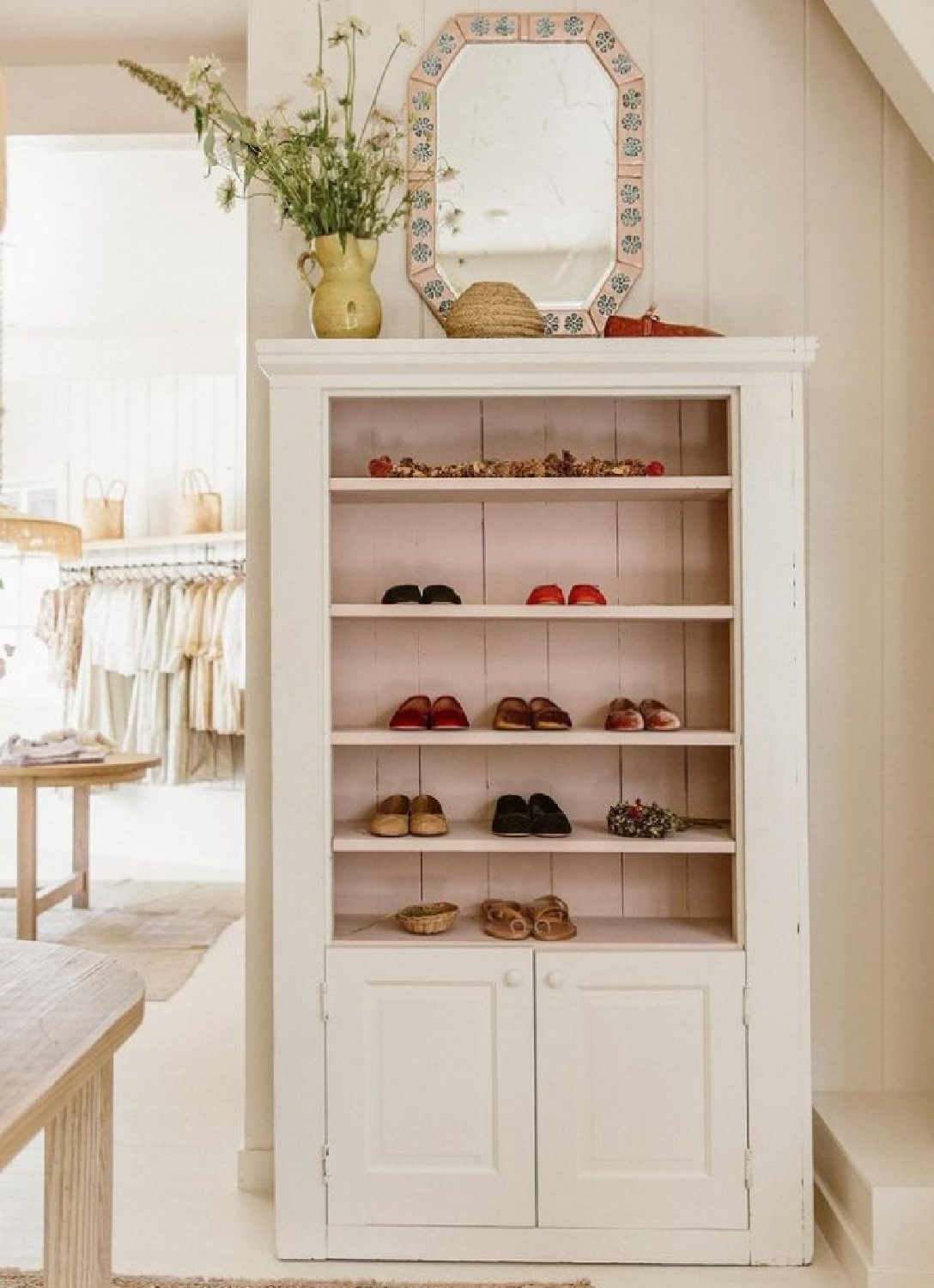 @shopdoen - gorgeous pink interior of a cupboard at Doen - paint color is Angel's Landing (Portola Paints). #blushpink #angelslanding #portolapinks