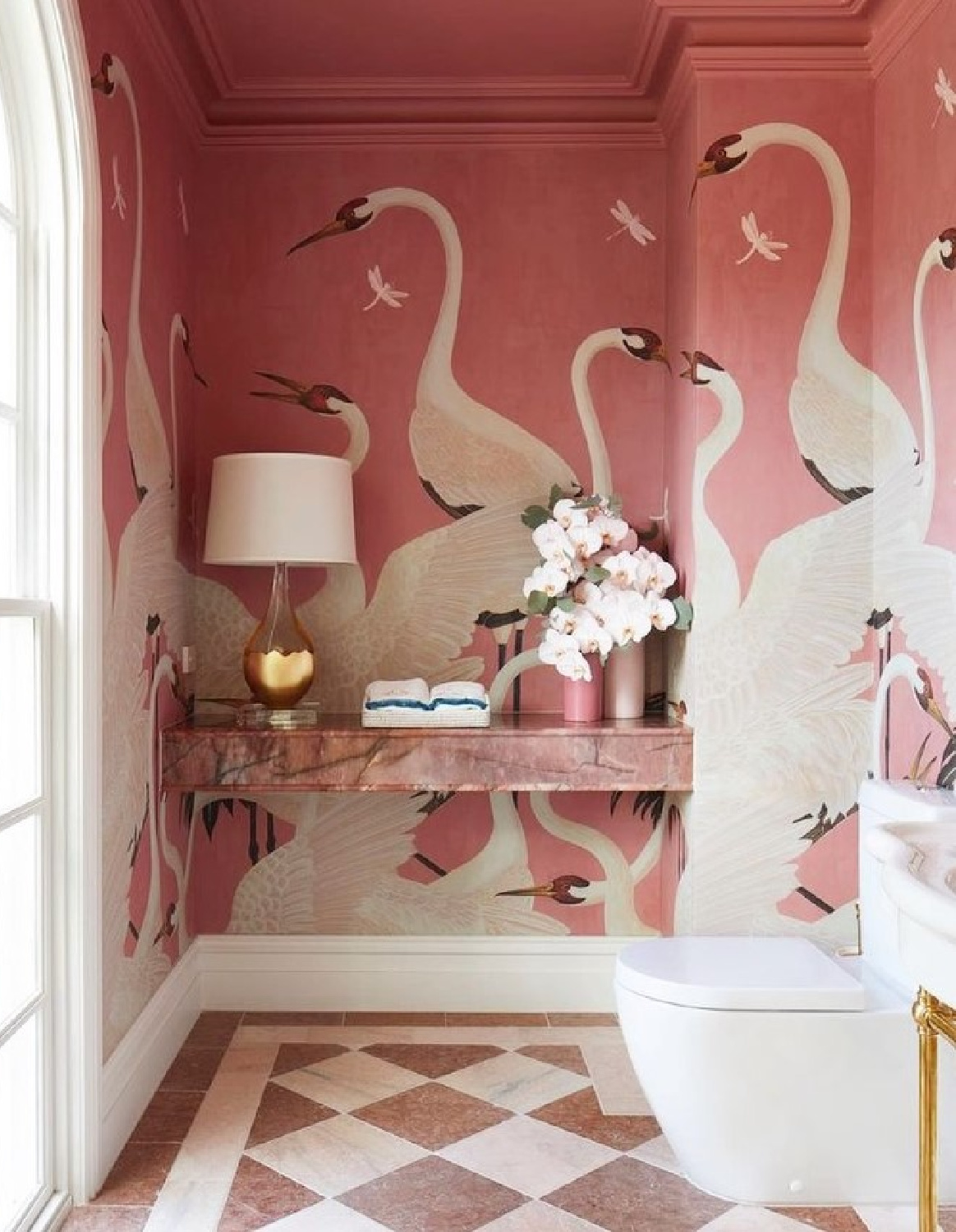 @voguelivingau - bold and whimsical pink bathroom by @katewalker_design with Gucci wallpaper and checkered floor. #pinkbathroom #gucciwallpaper #pinkinteriors