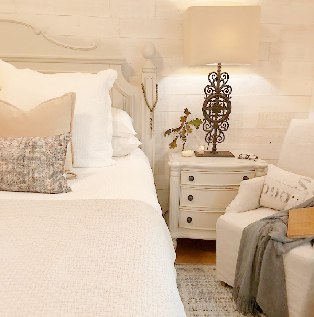 Hello Lovely European country bedroom with Stikwood shiplap (Hamptons), Zuma rug, Montara pillow on bed (Amber Lewis x Loloi) and Belgian linen chair. #europeancountry #romanticbedrooms