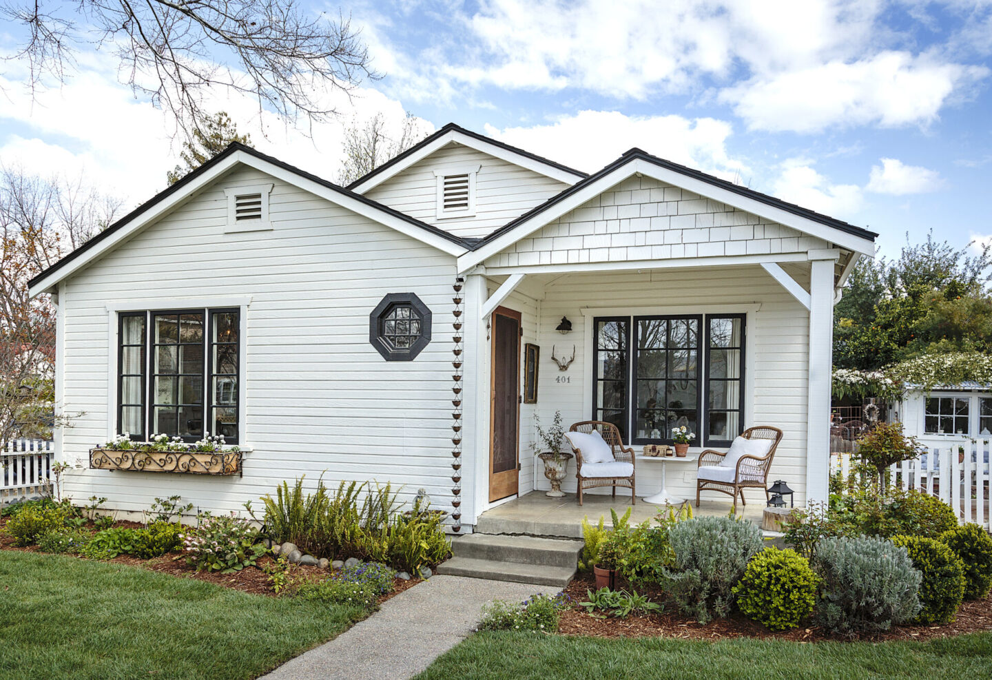 Lovely white cottage exterior from Fifi O'Neill's SHADES OF WHITE (2021).