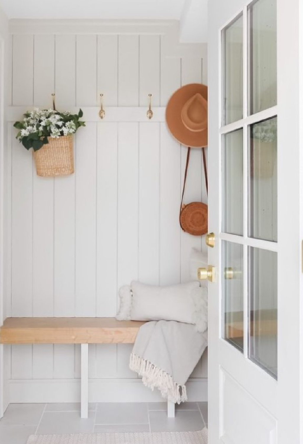 SW Agreeable Gray on wood paneled mud room wall - @saltandstone_co. #agreeablegray