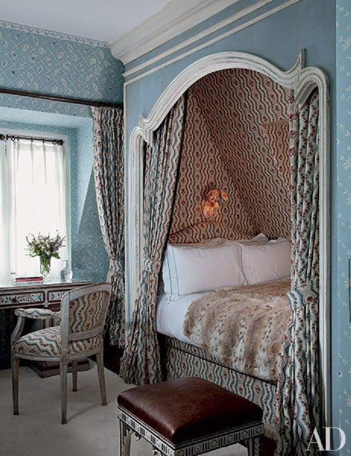Elegant wallcovering patterns in a Nicky Haslam designed bed nook in Architectural Digest.
