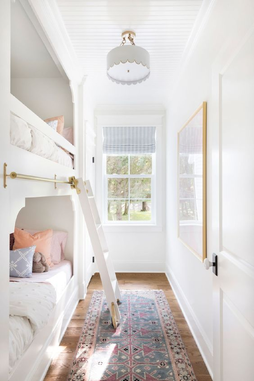 Small bedroom with built-in bunks designed by Bria Hammel. #bunkrooms