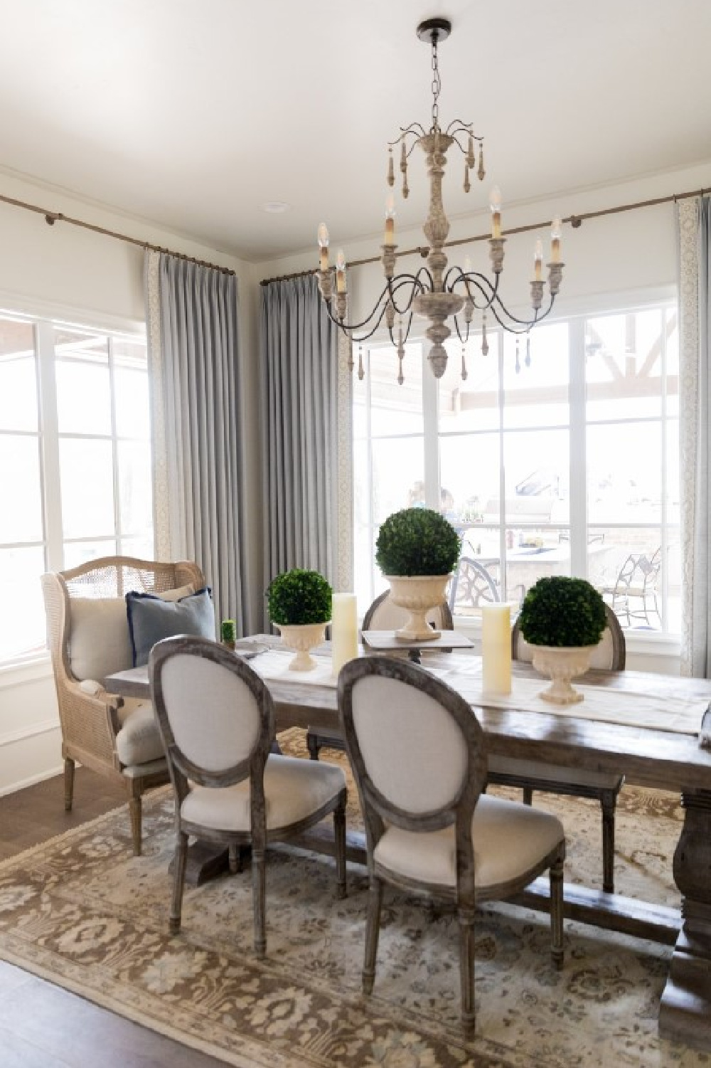 Sherwin-Williams Alabaster in a beautiful country French new build in Texas dining room with elegant chandelier - design by Brit Jones. #swalabaster #modernfrench