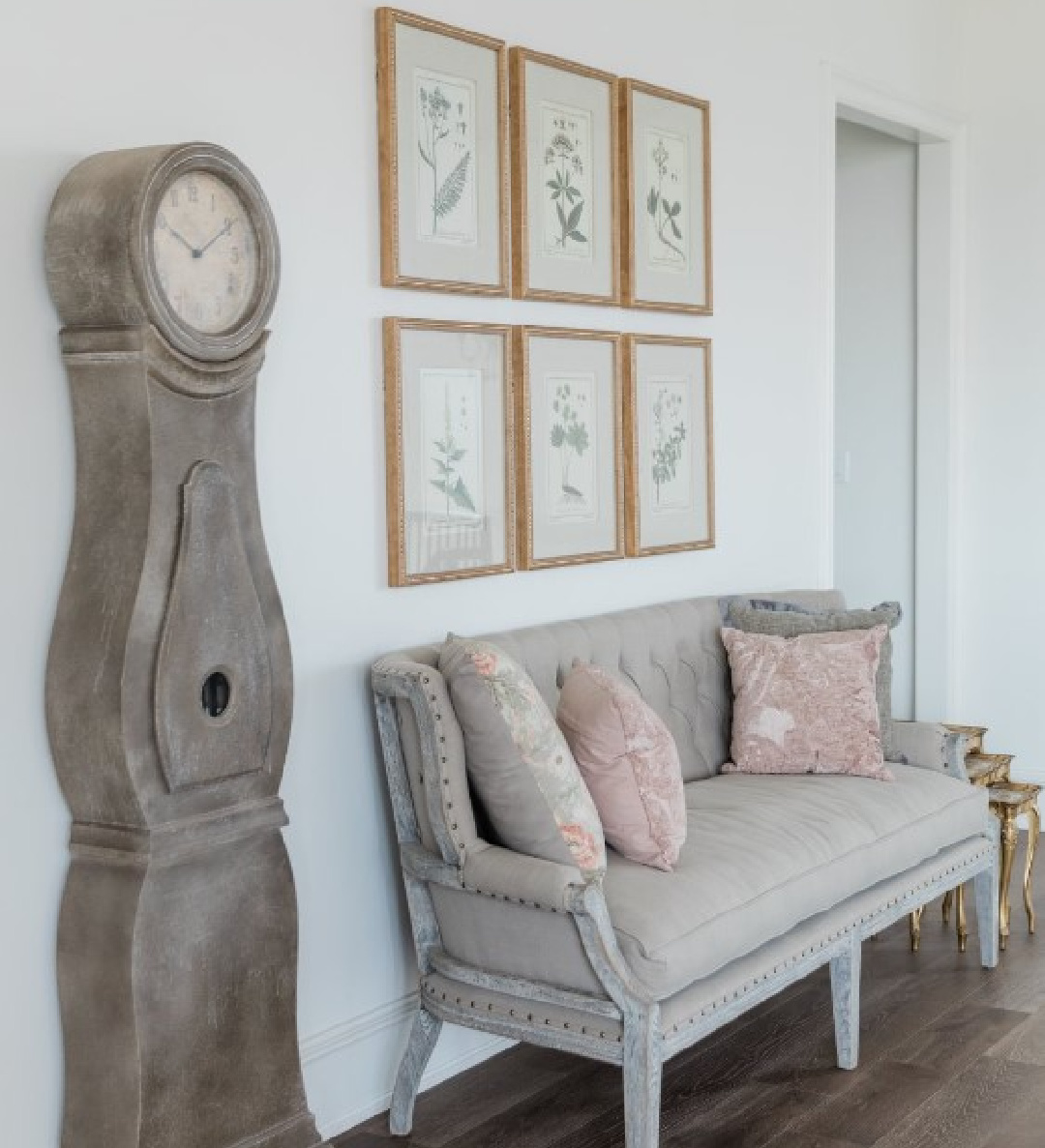 Country French landing with botanical prints, Mora clock and settee in a new build in Texas - Brit Jones Design. #countryfrench #botanicalprints