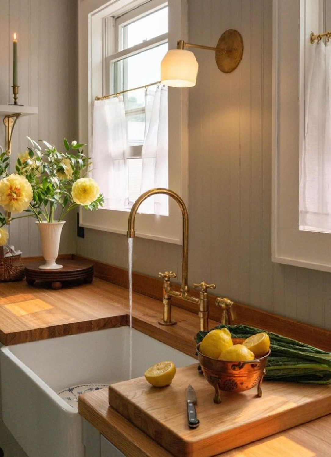 Pavilion Gray (Farrow & Ball) in an English country style kitchen by @emma_austen with handmade artisan elements and wood counters. #paviliongray #graypaintcolors