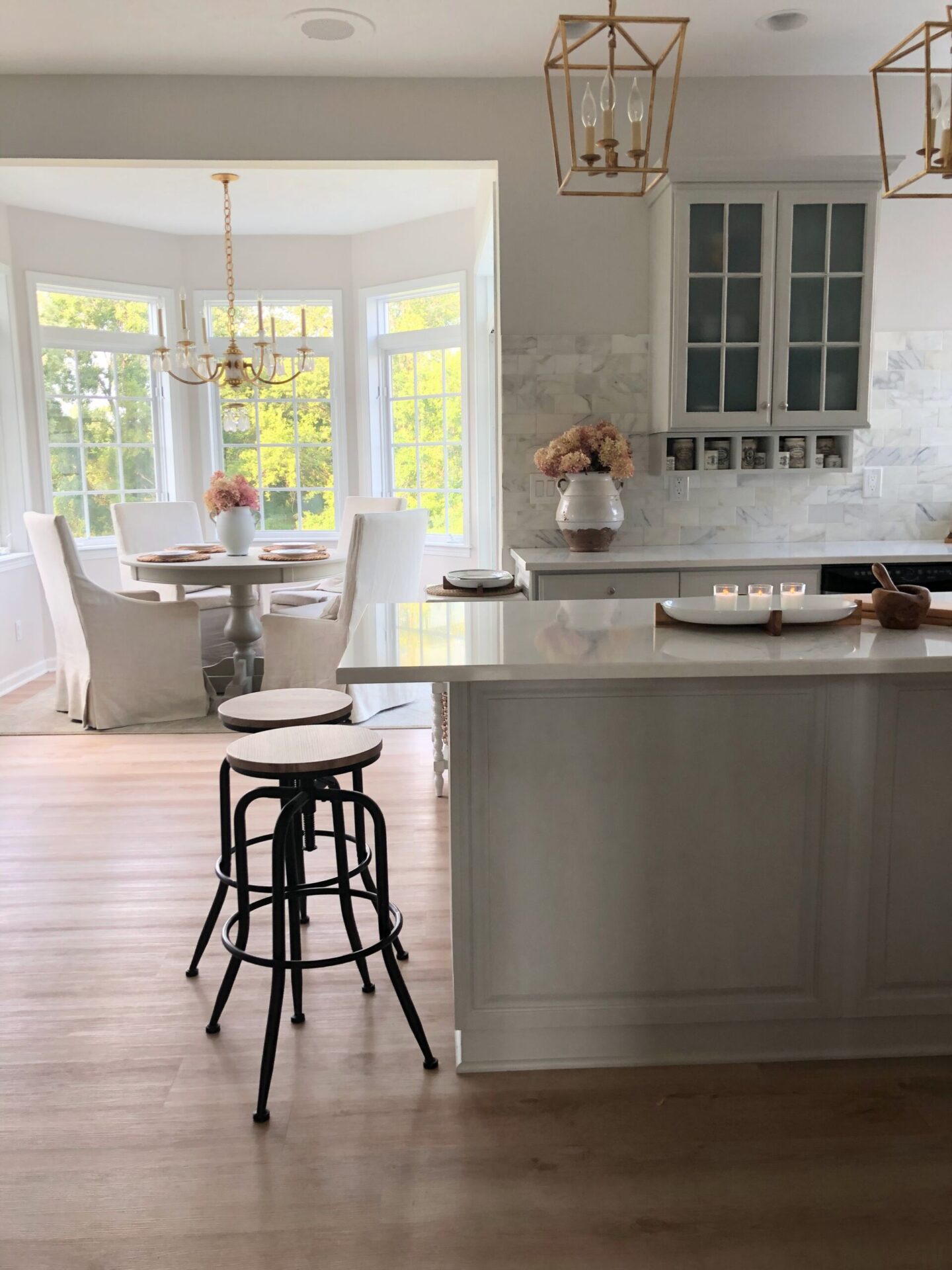 My modern French kitchen with Farrow & Ball Pavilion Gray at 66% on cabinets - Hello Lovely Studio. #modernfrench #paviliongray #eiderwhite