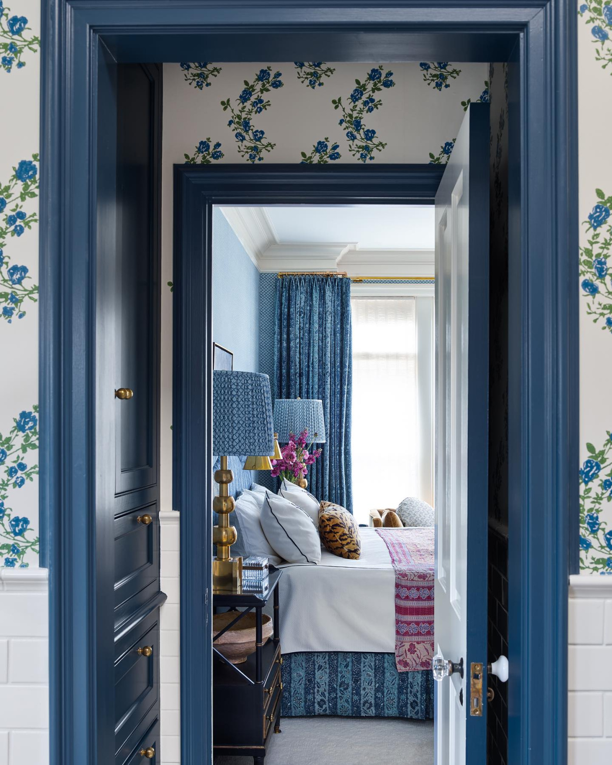 Bedroom with navy blue trim and floral wallpaper - Summer Thornton Design.