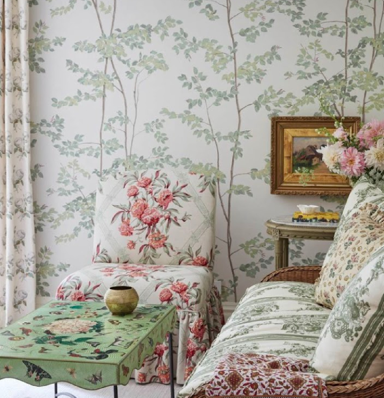 Green leafy wallpaper and Boxwood curtains in a sitting area of bedroom designed by Summer Thornton. #summerthornton