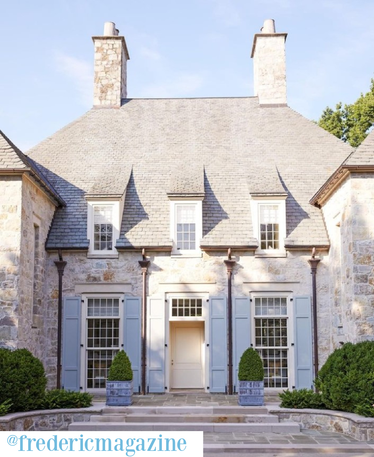 Timeless European inspired stone house exterior with light blue shutters in @fredericmagazine. Architect: Pursley Dixon; Interiors: Suzanne Kasler; Photo: @melanieacevedophoto. #europeancountry #luxuryhomeexterior