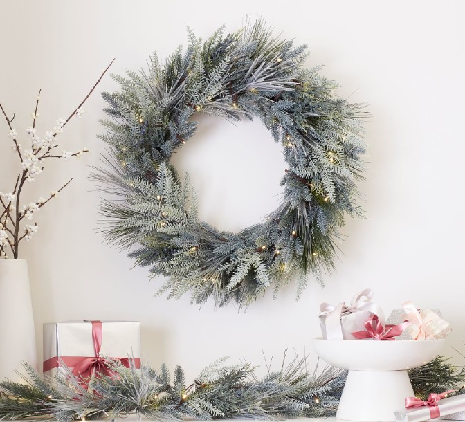 Lit, flocked, faux pine wreath for Christmas, Pottery Barn.