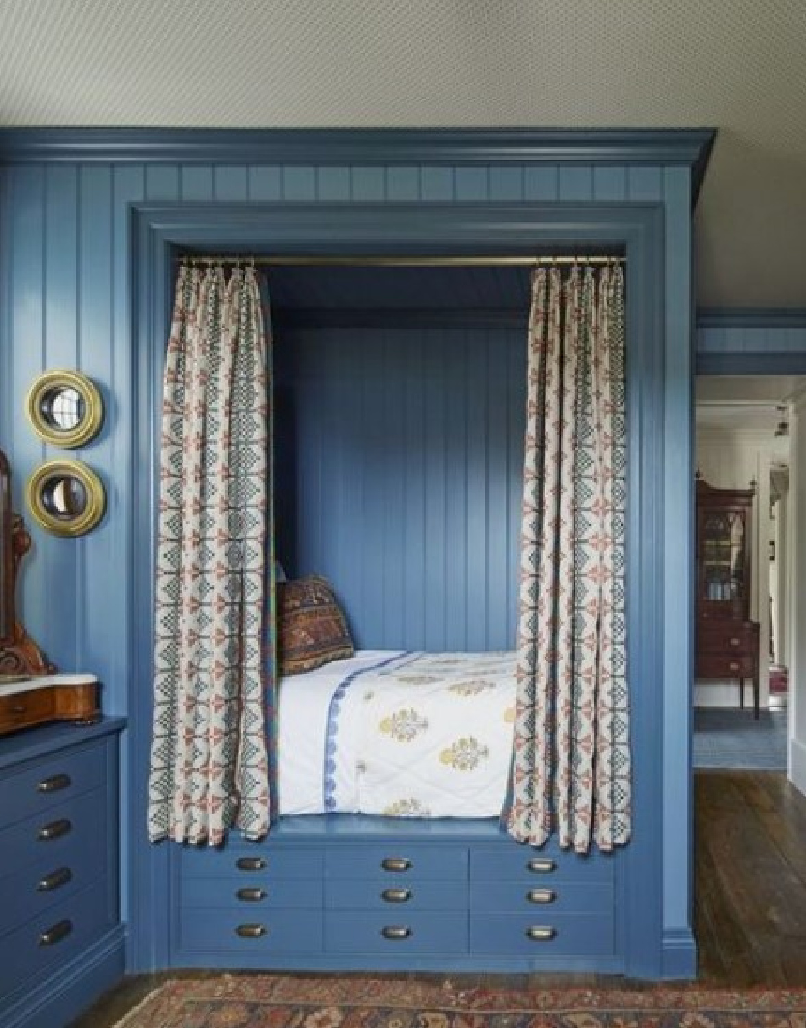 Blue paneled bed nook with curtains in a beautiful interior - @theglampad. #bednooks