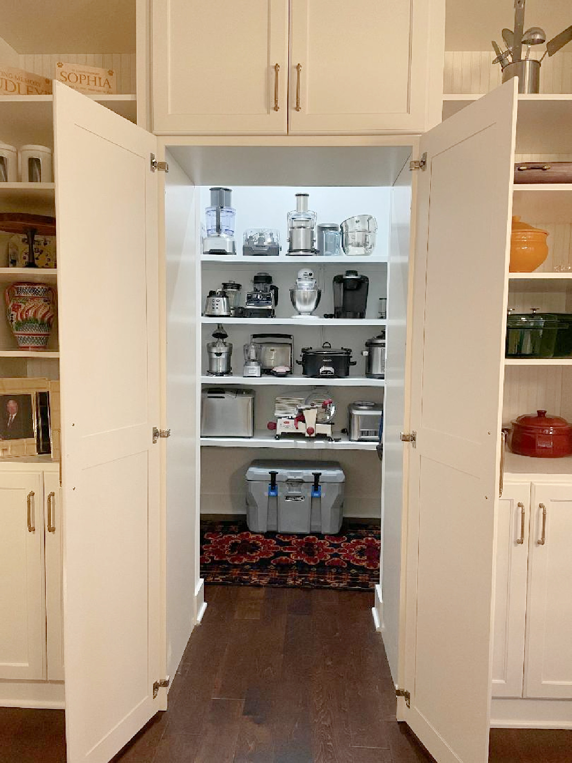 Hidden walk-in pantry in a beautiful timeless French kitchen design - Hello Lovely Studio. #kitchenpantry #hiddenpantry