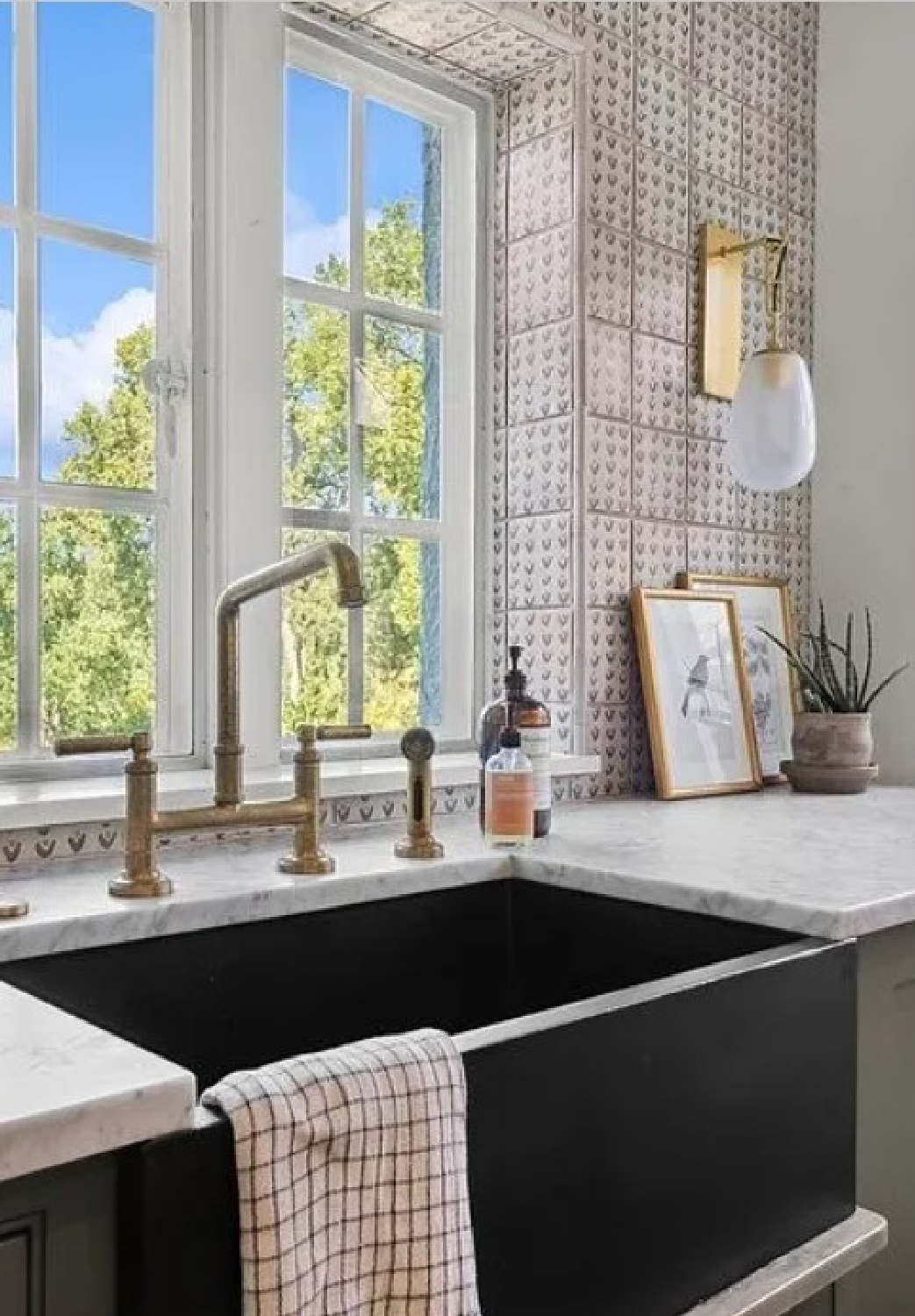 Tiled wall and farmhouse sink with Kallista faucet in Kate Marker's 1920 white stucco Barrington Hills, IL Home (160 N. Buckley Rd) with modern, serene, unfussy, timeless interiors. #katemarkerinteriors @thedawnmckennagroup #katemarkerhome