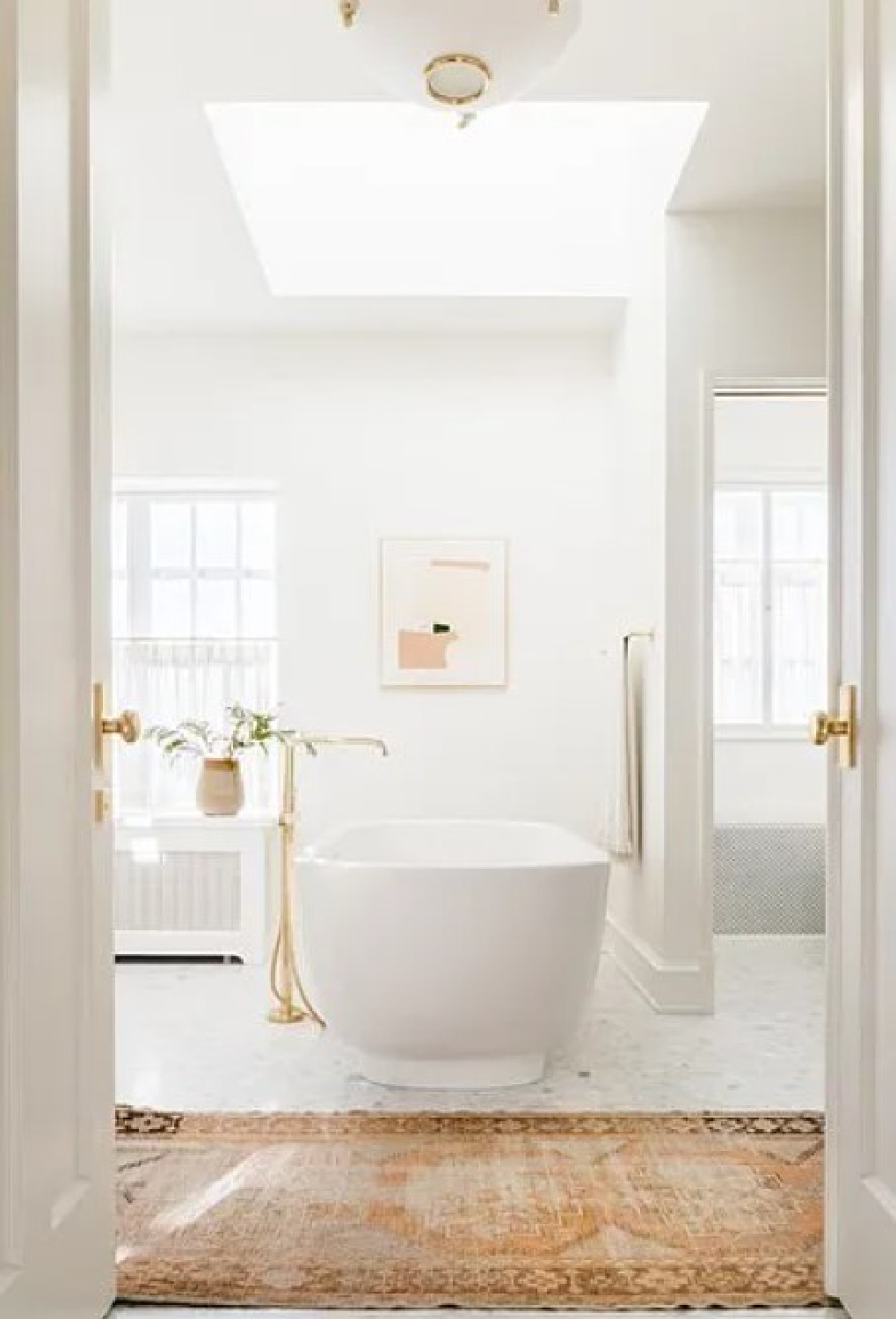 Soaking tub in bath of Kate Marker's 1920 white stucco Barrington Hills Home (160 N. Buckley Rd) with modern, serene, unfussy, timeless interiors. #katemarkerinteriors @thedawnmckennagroup #katemarkerhome