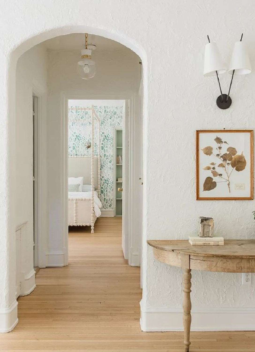 Archway in hall to bedroom in Kate Marker's 1920 white stucco Barrington Hills Home (160 N. Buckley Rd) with modern, serene, unfussy, timeless interiors. #katemarkerinteriors @thedawnmckennagroup #katemarkerhome