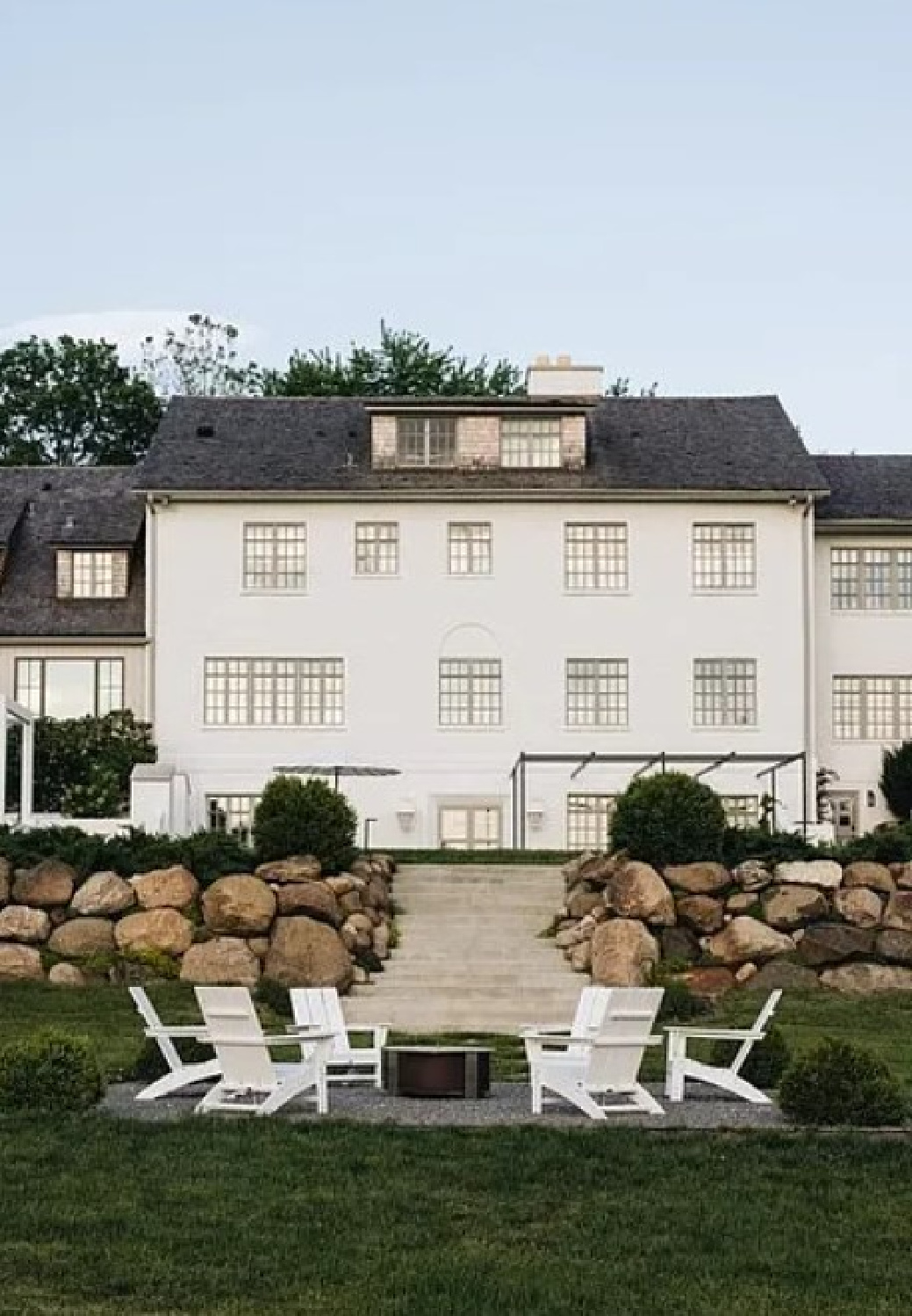 Exterior of Kate Marker's 1920 white stucco Barrington Hills Home (160 N. Buckley Rd) with modern, serene, unfussy, timeless interiors. #katemarkerinteriors @thedawnmckennagroup #katemarkerhome