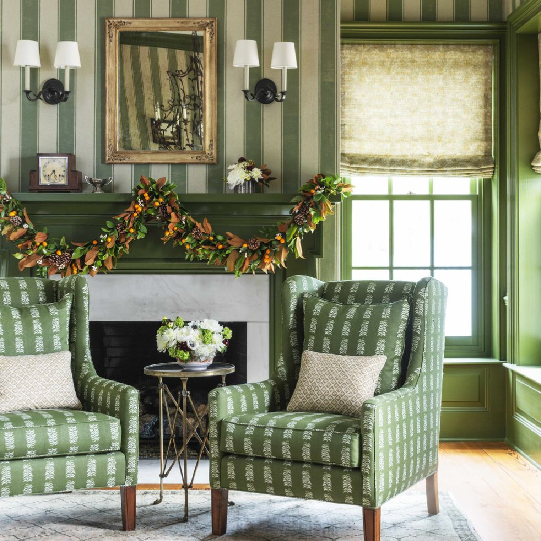 Beautiful citrus garland on holiday fireplace (Andrew Howard) with chairs (fabric is Heather Chadduck) in Veranda magazine (Helen Norman). #christmasgarland #christmasfireplace