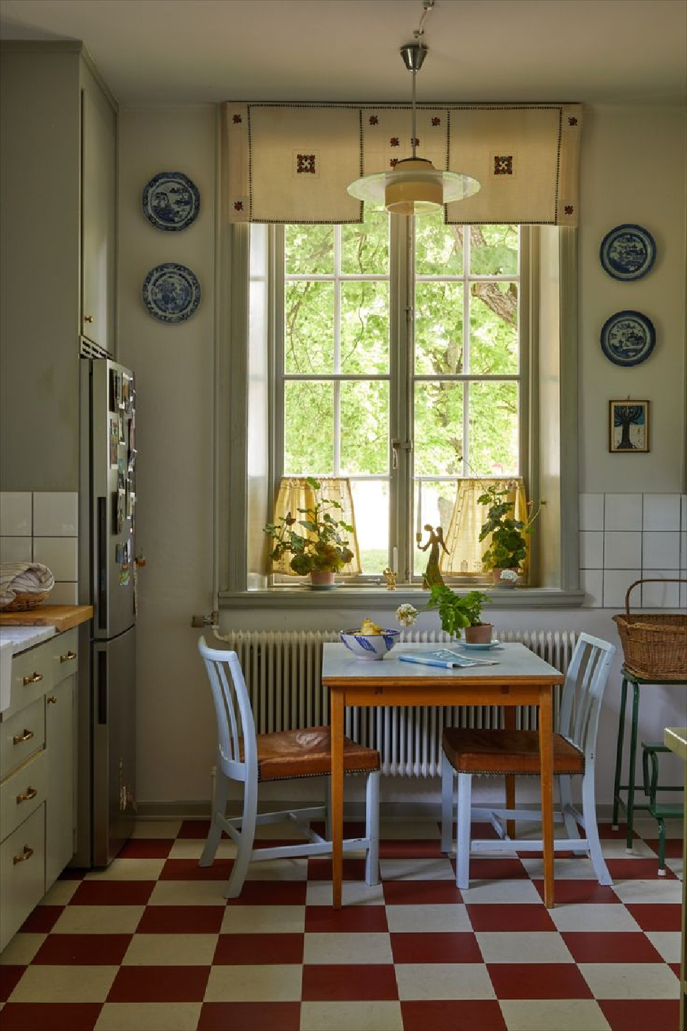 Beata Heuman's own Swedish farmhouse kitchen with checkered floor.
