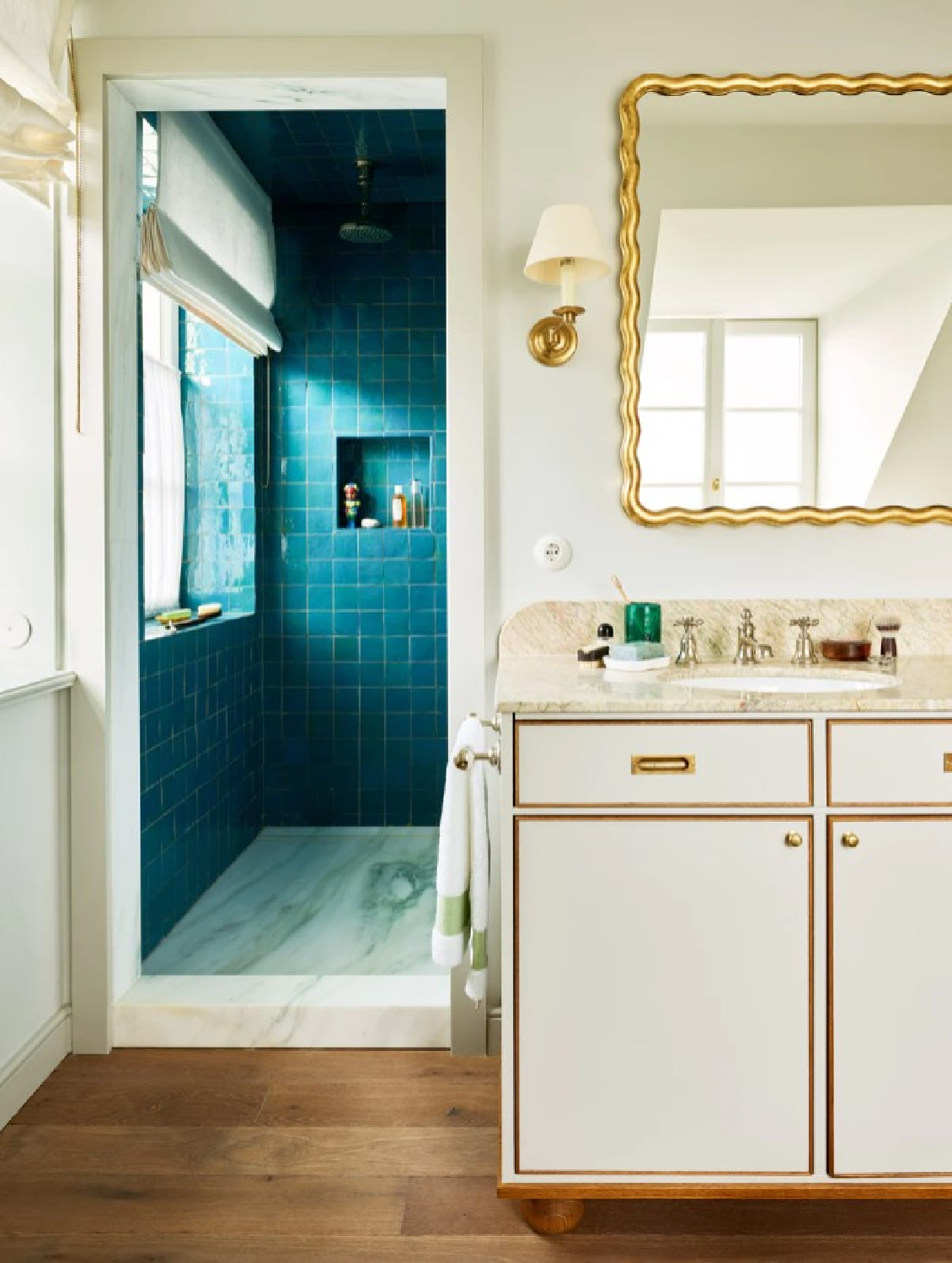 Teal tile in a shower in a bath with design by Beata Heuman - photo by Robert Reiger.