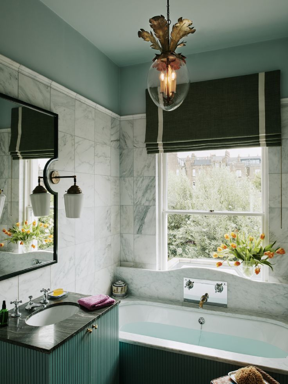 Brass Dodo Egg Lantern pendant hangs in a beautiful carrera covered bathroom - Simon Brown photo and Beata Heuman interior design. #beataheuman #swedishfarmhouse