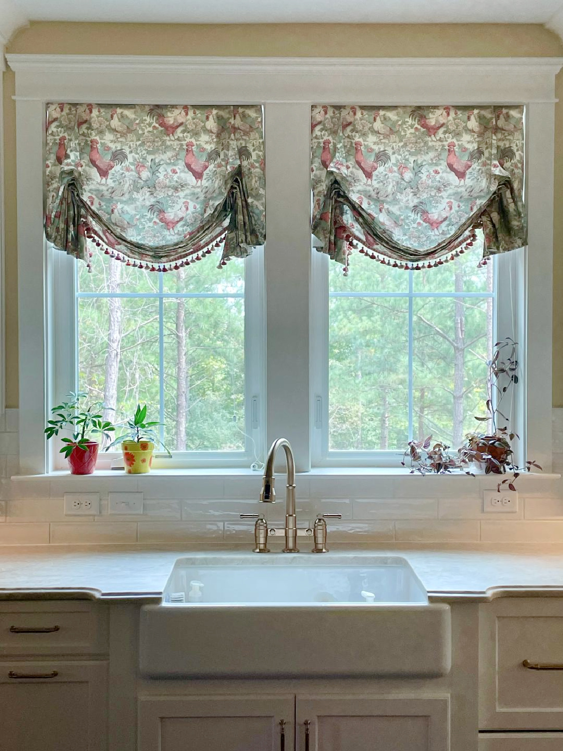 French country kitchen with custom chicken toile London shades, white cabinets, and quartzite counters - Hello Lovely Studio. #frenchcountrykitchen