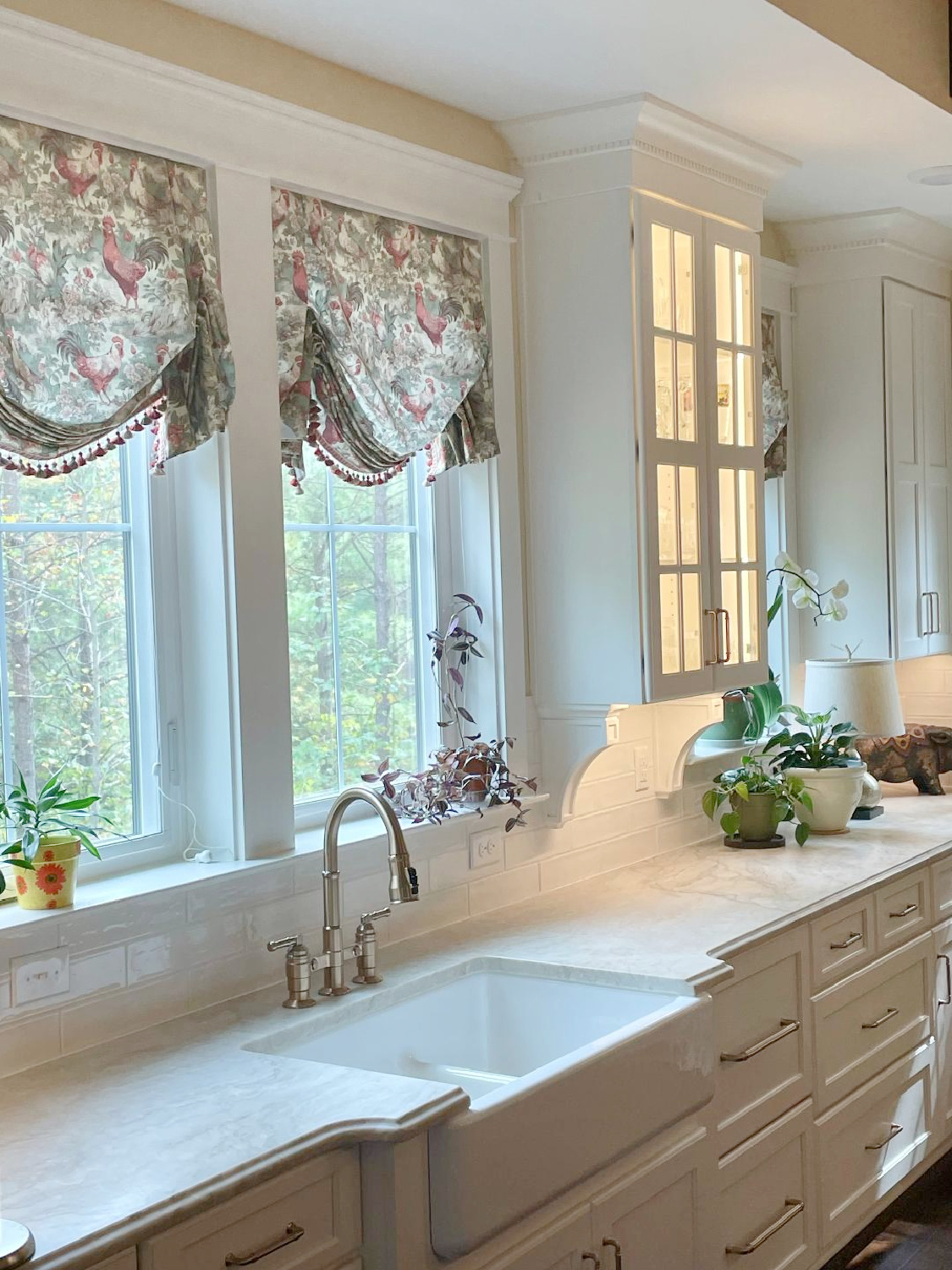 French country kitchen with custom chicken toile London shades, white cabinets, and quartzite counters - Hello Lovely Studio. #frenchcountrykitchen