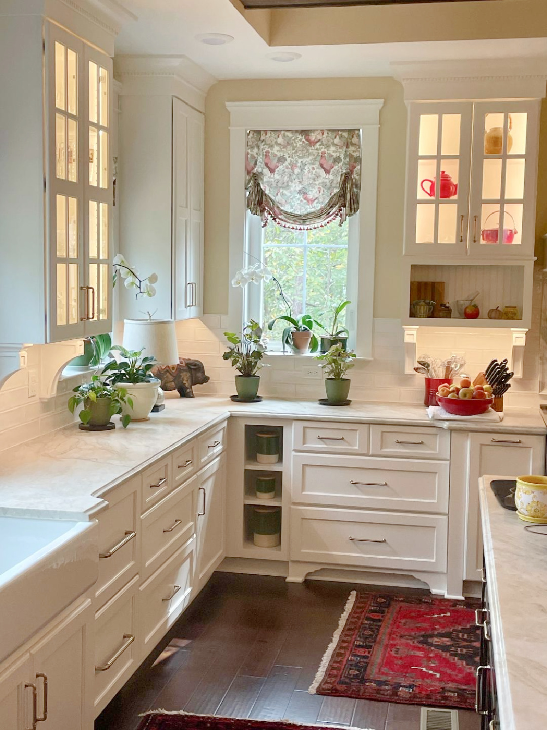 French country kitchen with custom chicken toile London shades, white cabinets, and quartzite counters - Hello Lovely Studio. #frenchcountrykitchen