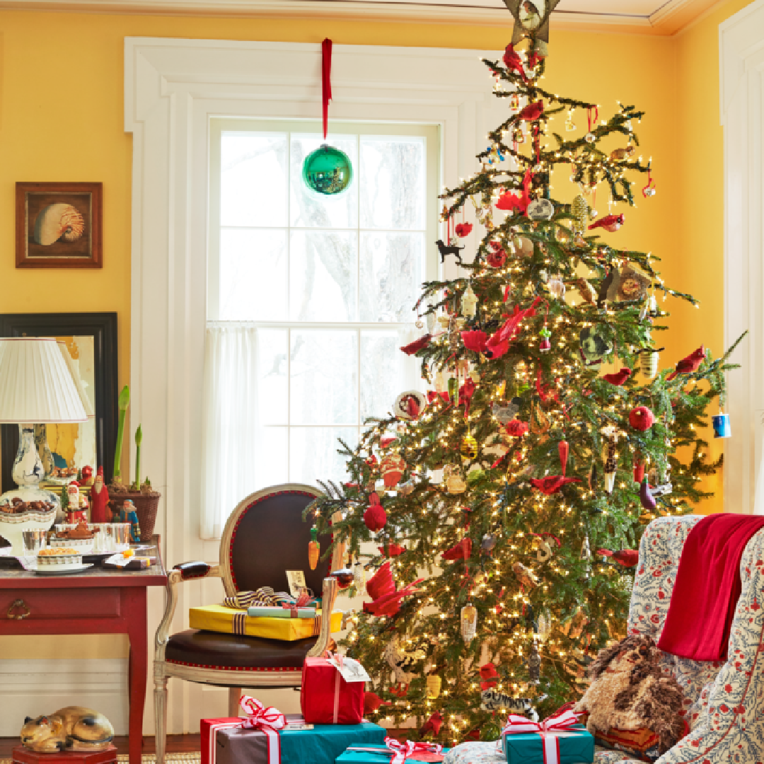 Christopher Spitzmiller Christmas tree in room painted BM Sweet Butter - Veranda (Melanie Acevedo). #holidaydecor