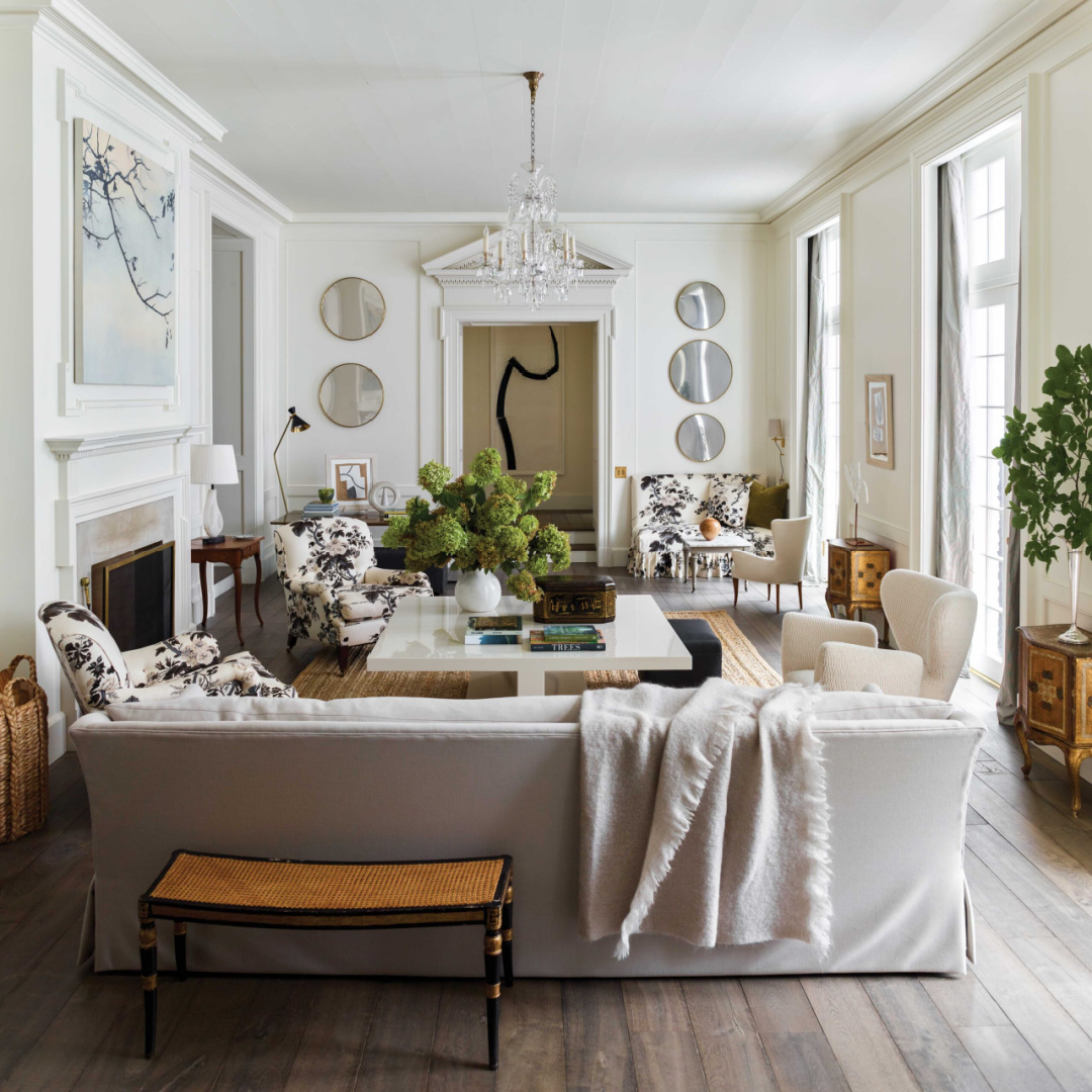 Modern traditional living room in an Atlanta home by D. Stanley Dixon with interiors by Carolyn Malone. Ivory club chairs by Coup d’État and a custom coffee table hit a more contemporary note. #moderntraditional #carolynmalone #stanleydixon