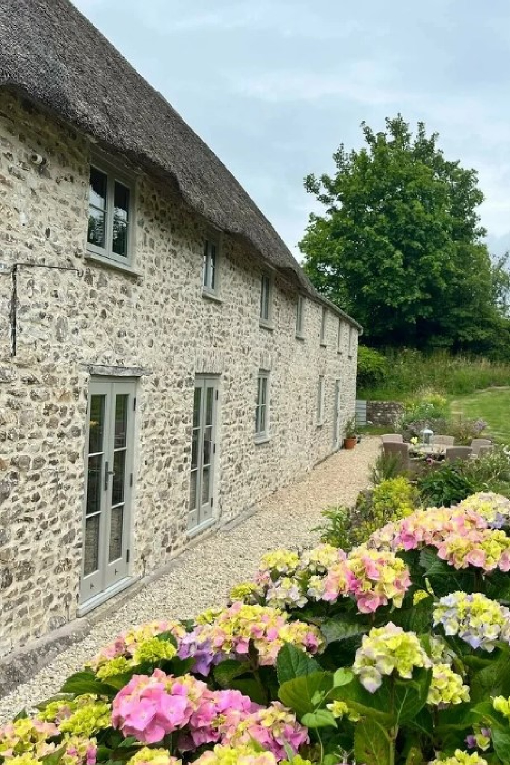 Hardwick White on exterior trim of stone English cottage - @cottage_renovation_somerset. #hardwickwhite