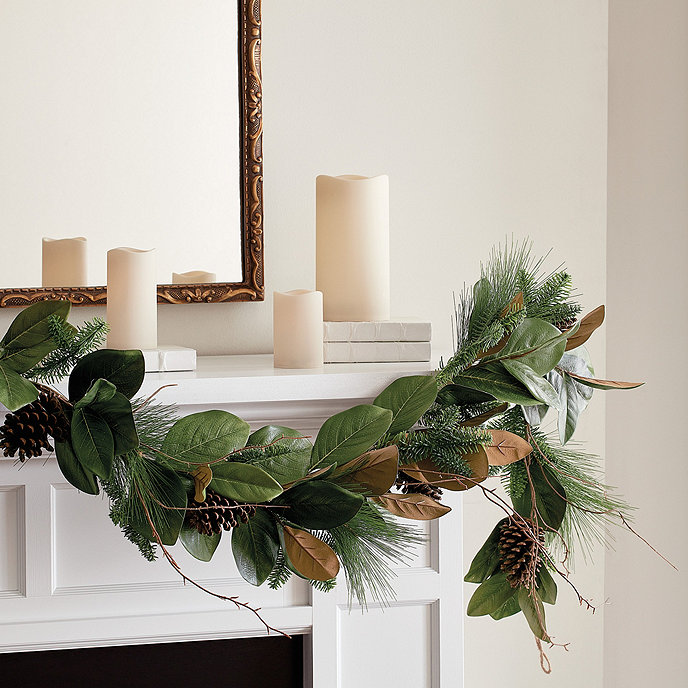 Pine and magnolia garland on fireplace mantel, Ballard Designs. #magnoliagarland #christmasgarland