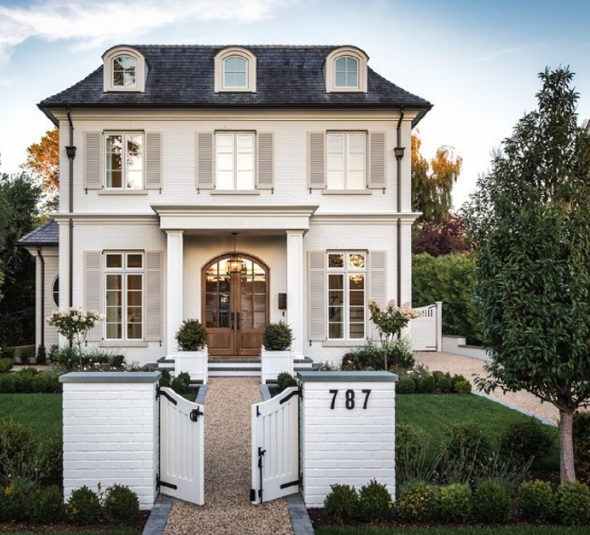 Maison de Lee - a beautiful French inspired new build with interiors designed by Jenny Martin Design. Exterior painted BM Gray Mist and shutters are Revere Pewter. #bmgraymist #bmreverepewter #modernfrench