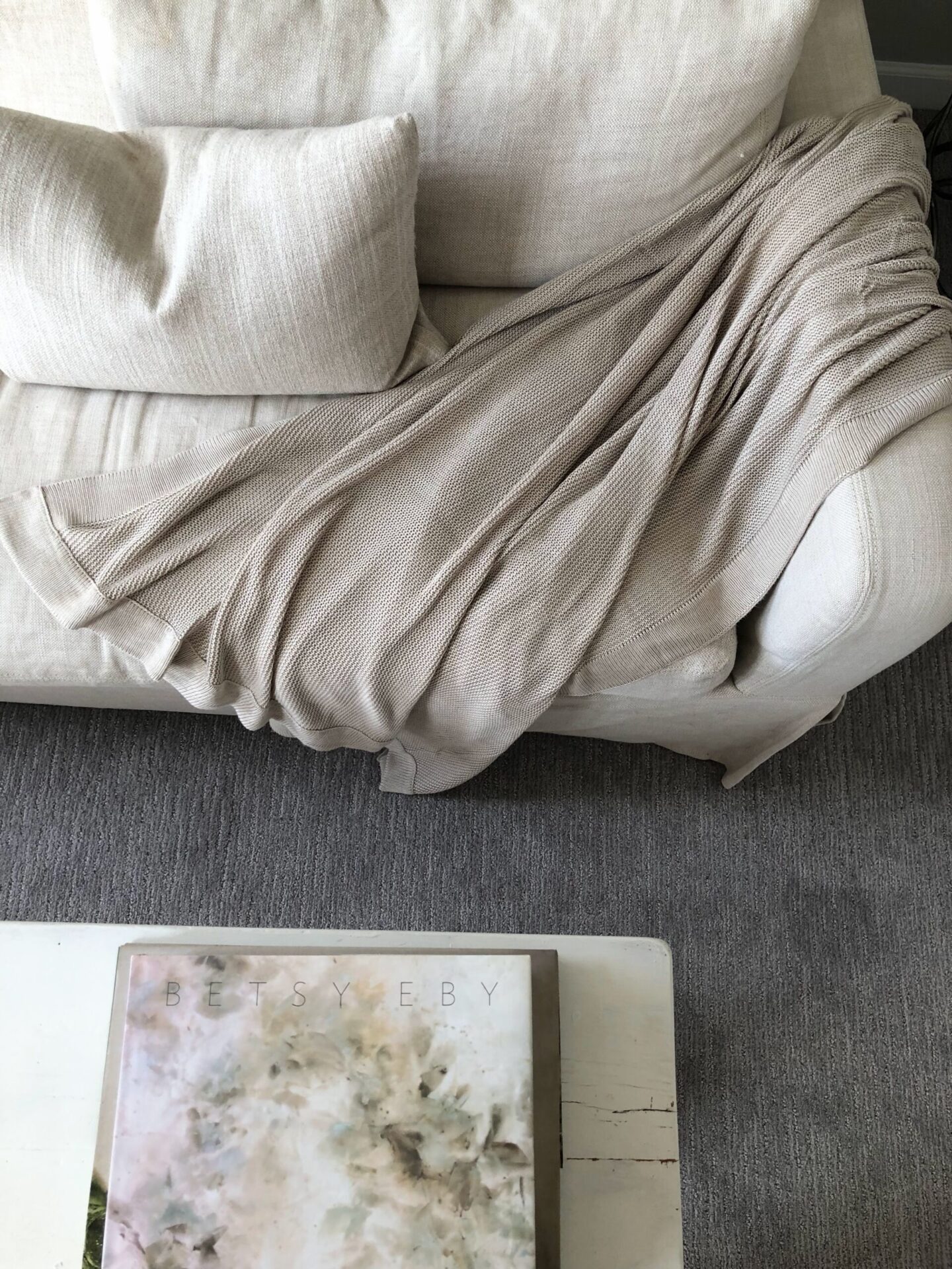 Cozy Earth Cloud Knit Blanket Throw (Driftwood) on my Belgian linen sofa - Hello Lovely Studio. #cozyearth #cloudknitblanket #belgianlinen #belgianstyle #toneontone