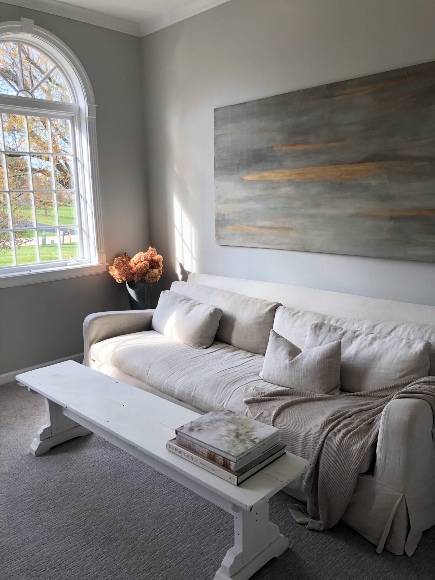 Cozy Earth Cloud Knit Blanket Throw (Driftwood) on my Belgian linen sofa. Walls are Sherwin Williams Repose Gray - Hello Lovely Studio. #cozyearth #cloudknitblanket #belgianlinen #belgianstyle #reposegray