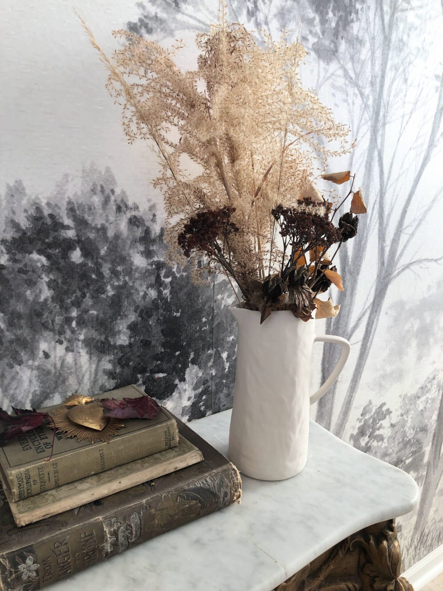 Fall foraged arrangement in the entry at the Georgian with scenic tree mural  - Hello Lovely Studio. #falldecor