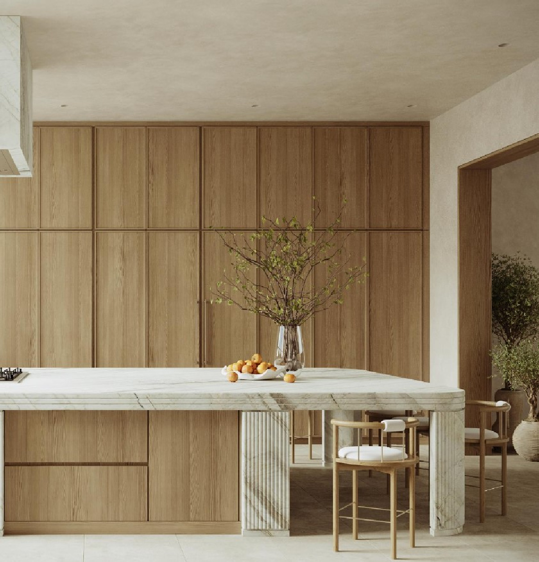 @noasantos designed kitchen with a wall of cabinetry, layered marble, and serene minimal design. #minimaldesign #minimalkitchen