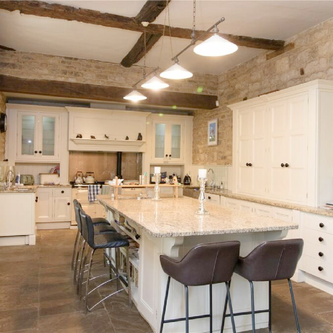 Kitchen with stone walls and white cabinetry - Barn Hill House (historic Georgian built in 1698 in Stamford, UK). #georgianarchitecture #historichomes #barnhillhouse