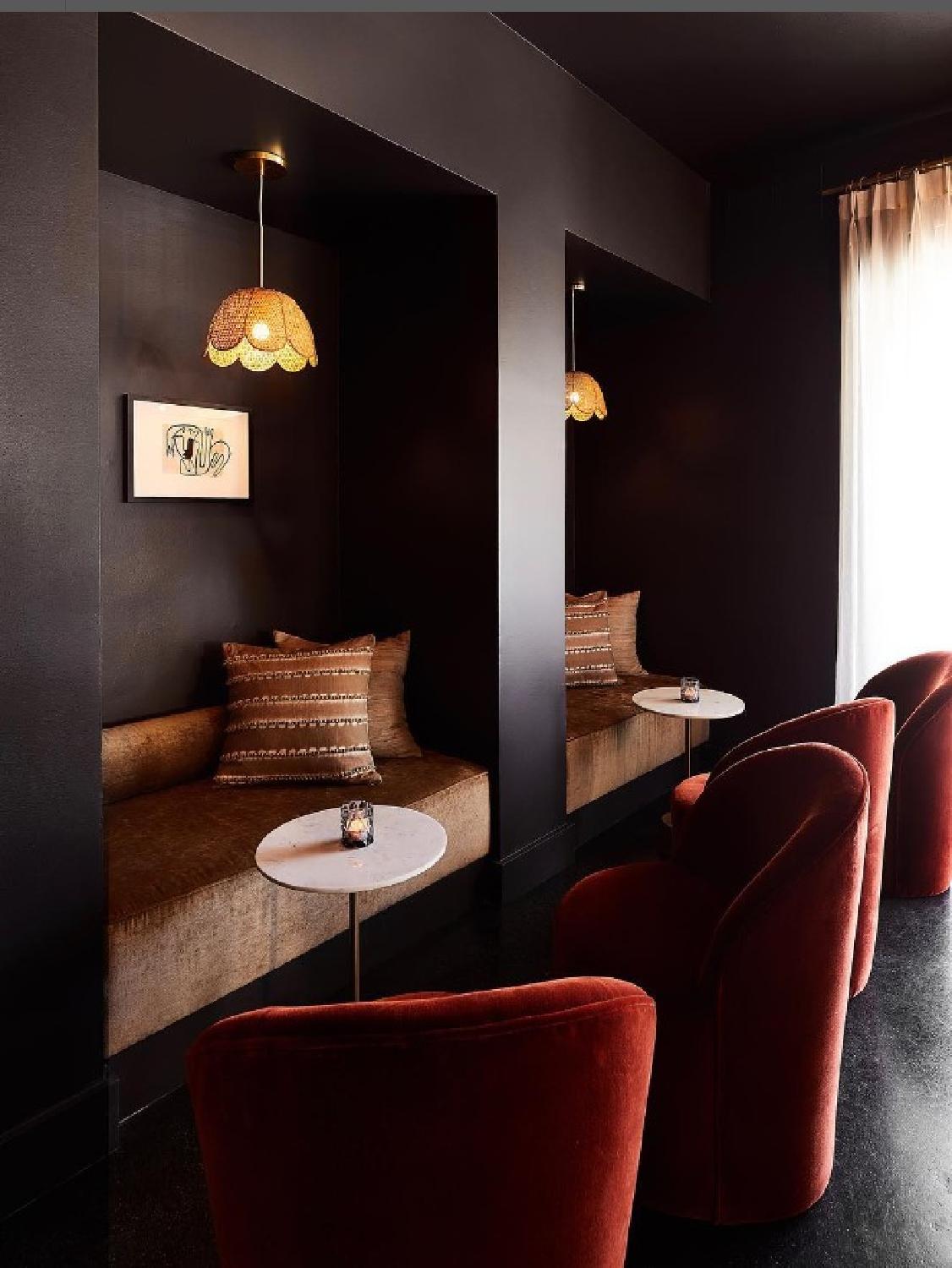 Deep Caviar (Benjamin Moore) black paint color in a chic bar area with velvet chairs and moody vibe - @narrativesf. #bmdeepcaviar #blackpaintcolors